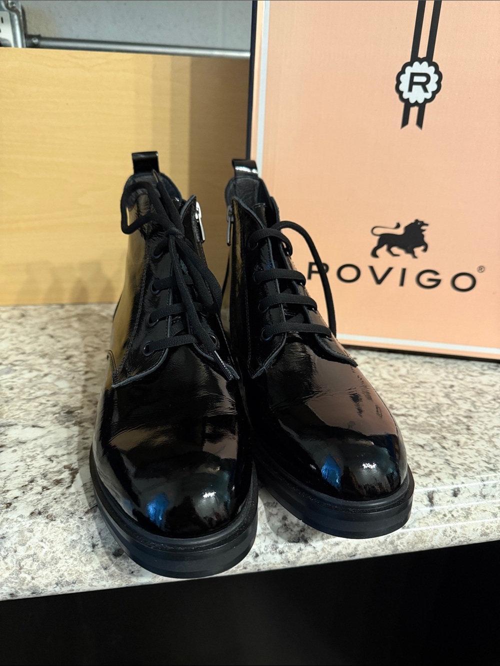 New in box. Rovigo black patent lace up bootie